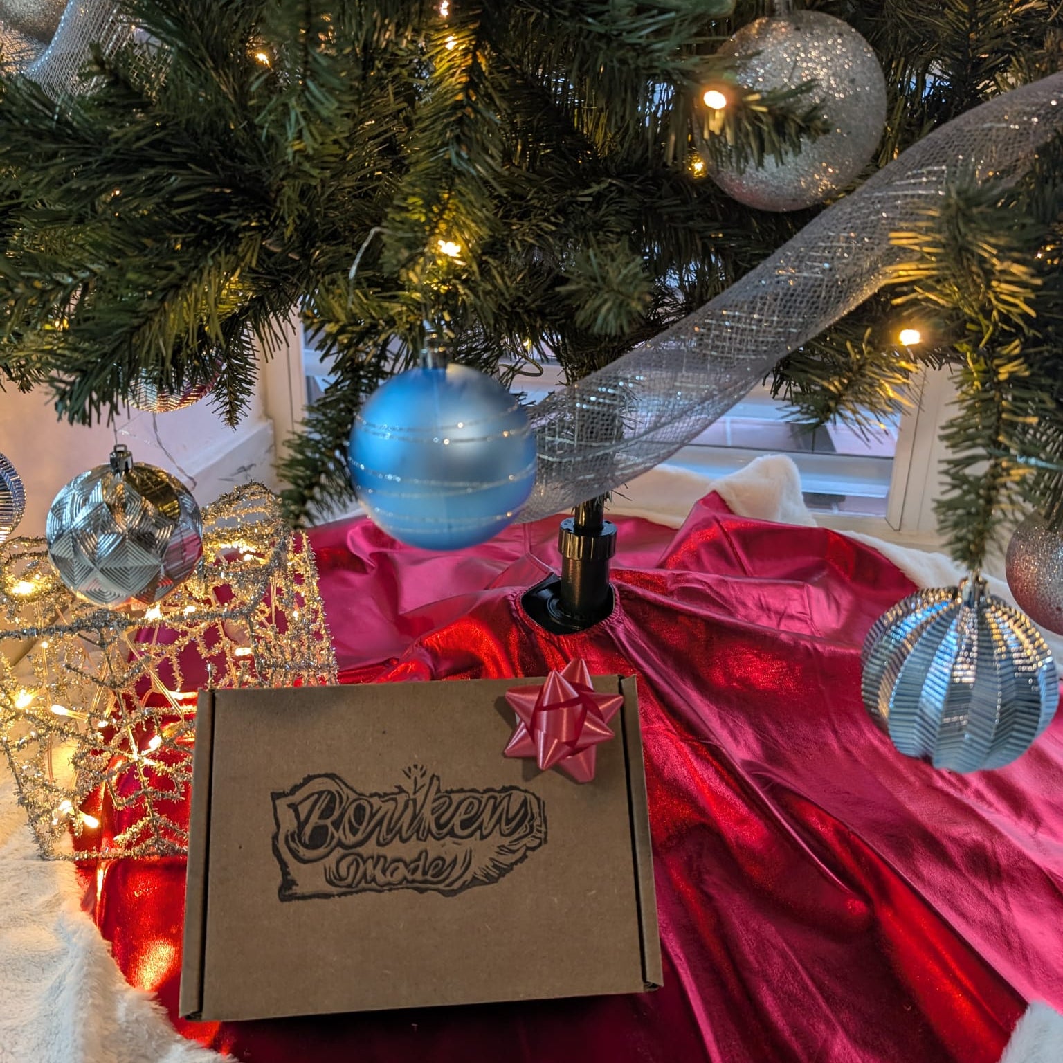 Box with 'Bonkers Wines' branding under a decorated Christmas tree.